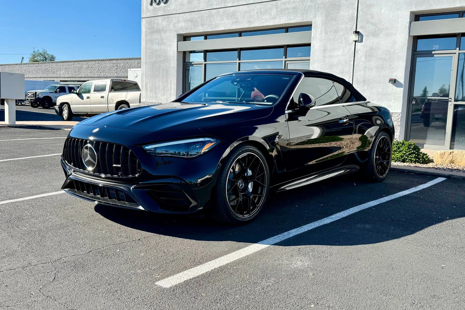 Black convertible with a deep reflective finish after AutoWorks paint correction