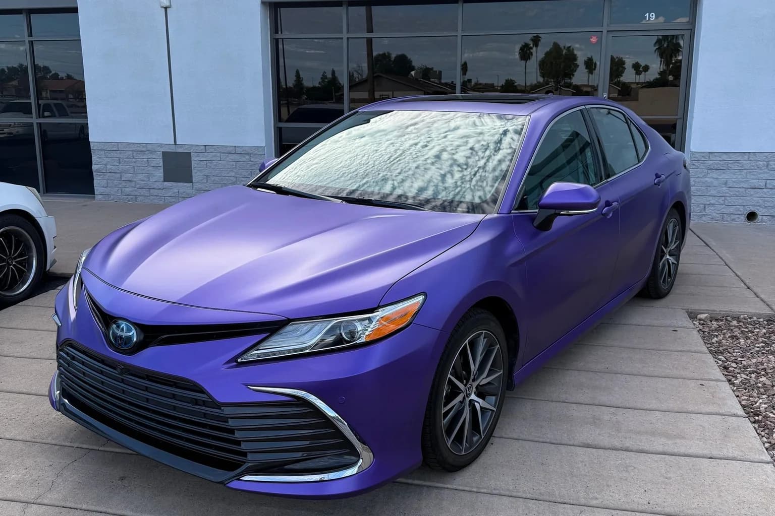 Purple satin sedan after an AutoWorks color-change vinyl wrap