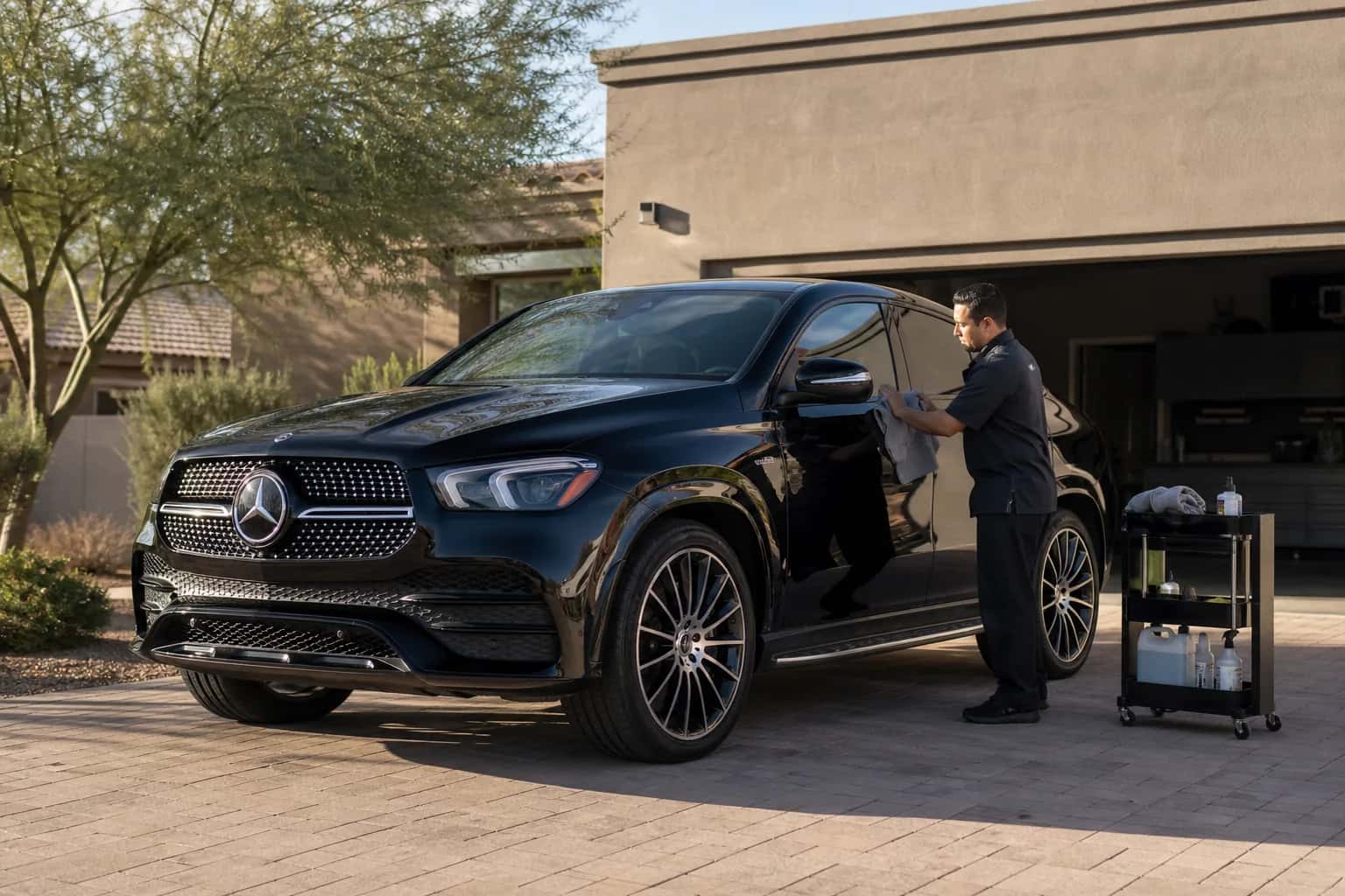 Black Mercedes SUV receiving a mobile maintenance detail at a Gilbert home